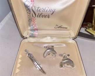 Lot 6104. $25.00. Anson sterling silver trout cuff links and fly rod tie clip. Great gift for your favorite fly! Also includes 5 vintage pocket knives (bakelite or mother of pearl), a mini spray can (that works!), and 2 tie pins?