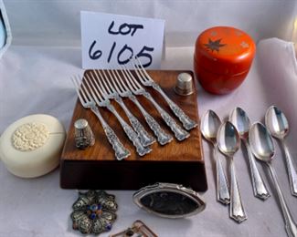 Lot 6105.$60.00. 6 sterling cocktail forks, 5 sterling demitasse-spoons, lipstick case w/mirror, filigree silver pendant w/lapis & coral stones, 2 thimbles, covered decorated lacquered and a "faux" ivory string box.