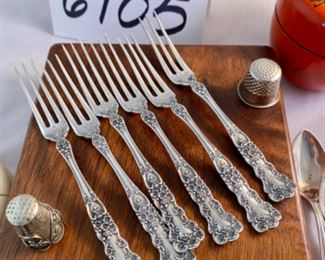 Lot 6105.$60.00. 6 sterling cocktail forks, 5 sterling demitasse-spoons, lipstick case w/mirror, filigree silver pendant w/lapis & coral stones, 2 thimbles, covered decorated lacquered and a "faux" ivory string box.