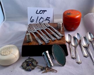 Lot 6105.$60.00. 6 sterling cocktail forks, 5 sterling demitasse-spoons, lipstick case w/mirror, filigree silver pendant w/lapis & coral stones, 2 thimbles, covered decorated lacquered and a "faux" ivory string box.