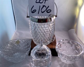 Lot 6106. $45.00. Textured lead crystal ice bucket w/tongs (6"t x 4"dia), crystal covered jelly jar fruit shaped,(5"t x 3"dia), Kosta signed bowl (4"w x 3"t), lenox bowl (5"dia x 2"tall).