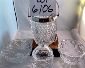 Lot 6106. $45.00. Textured lead crystal ice bucket w/tongs (6"t x 4"dia), crystal covered jelly jar fruit shaped,(5"t x 3"dia), Kosta signed bowl (4"w x 3"t), lenox bowl (5"dia x 2"tall).