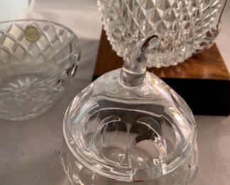 Lot 6106. $45.00. Textured lead crystal ice bucket w/tongs (6"t x 4"dia), crystal covered jelly jar fruit shaped,(5"t x 3"dia), Kosta signed bowl (4"w x 3"t), lenox bowl (5"dia x 2"tall).