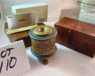 Lot 6110 $80.00. What a Lot! Beautifully Crafted Jeffrey Seaton Wood Design "Mountain Lilac Burl" Wooden Box 5.5" W 3" D x 2.75 H; Esprit Table Lighter 3.5" W x 2.5" with Advertising; Footed Pen Holder with World Map "Yaco di Firenze" Made in Italy, 3.5" x 3" Diam.