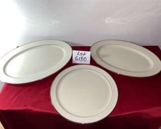 Lot 6130. $54.00 Lenox Montclair 3 pc. Platter Set. Includes a round platter: 12" round. 16"oval platter (medium), and a 17.5" oval platter (large). Beautiful White with Silver rim - goes with anything and in perfect shape!