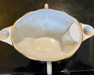 Lot 6132. $120.00. Antique Meissen Blue/White Soup Tureen w/underplate, in a lattice-work design,.we believe it's marked with the 1934 Meissen Mark of crossed swords. Made in Germany. Has a couple rim chips, but seem not to show. Also, Bonus: a Two-Spouted, 2 Handled Pitcher or Creamer, with a spout on either end. one spout is marked "M" and one "G", measures 6.5" in length, 5" from handle to handle. Such an unusual piece! Bottom is marked Made in France.