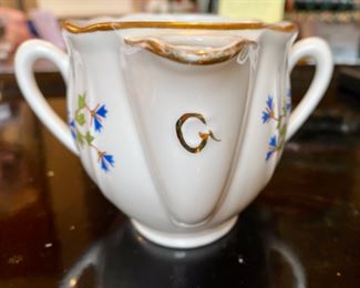 Lot 6132. $120.00. Antique Meissen Blue/White Soup Tureen w/underplate, in a lattice-work design,.we believe it's marked with the 1934 Meissen Mark of crossed swords. Made in Germany. Has a couple rim chips, but seem not to show. Also, Bonus: a Two-Spouted, 2 Handled Pitcher or Creamer, with a spout on either end. one spout is marked "M" and one "G", measures 6.5" in length, 5" from handle to handle. Such an unusual piece! Bottom is marked Made in France.