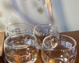 Lot 6133. $28.00 Mid Century Vintage Starburst serving tray. Also included is a set of Mid Century Cocktail glass set, with both 3" and 2" We are throwing in the little pitcher as the bottom is cloudy. the Tray Has a purpley hue and would be perfect for that crudite.