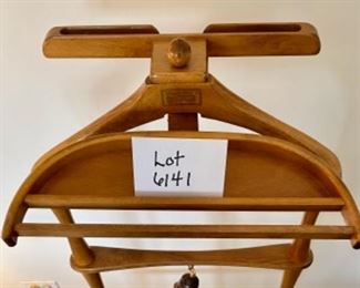 Lot 6141. $75.00 Fitwell Valet by C.Birnbaum Ltd. w/driftwood handled shoe horn that connects on a brass hook. Needs one more screw and wing to even it out.