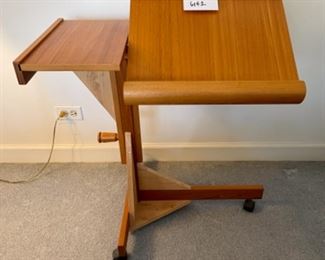 Lot 6142. $95.00 Adjustable Bedside/Work reading Station. Made in Denmark. The homeowners rigged it so it was a little more stable. This would be a great workstation.