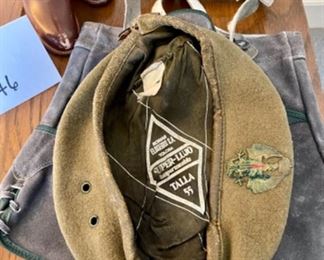 Lot 6146. $60.00 Child Size leather boots with some kind of weight on the inside, these could be used as a book end or decor. Also a Spain-Made Bseret with an Eagle Emblem and a pair of Leather Child size Leiderhosen.