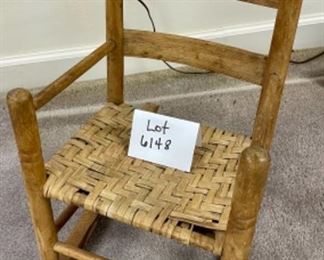 Lot 6148. $42.00. Antique Children's Splint Seat Rocking Chair