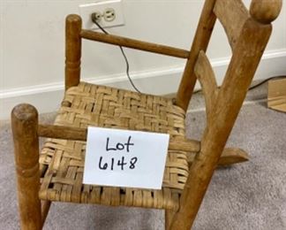 Lot 6148. $42.00. Antique Children's Splint Seat Rocking Chair