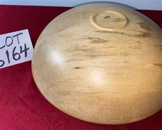 Lot 6164. $45.00. Hand-turned wooden bowl with JH on the bottom. The bowl is made of one piece of wood and appears to be some sort of wormwood, but after exhausting a search, we really aren't sure what the wood is exactly. All we know is this is a very unique and attractive bowl! 13"w x 6"h