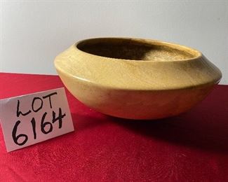 Lot 6164. $45.00. Hand-turned wooden bowl with JH on the bottom. The bowl is made of one piece of wood and appears to be some sort of wormwood, but after exhausting a search, we really aren't sure what the wood is exactly. All we know is this is a very unique and attractive bowl! 13"w x 6"h