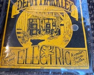 Lot 6157. $24.00 "The Guitar Book" by Ralph Denyer, and Ferrington "Guitars" Extremely Cool Guitar book, and Dean Markley Electric Guitar Strings 2nd, rth and 5th.