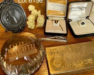 Lot 6156. $75.00. Lot of Random but cool items: 1.Univ. of Miami Heritage Society Paperweight, 2, The Great Seal of State of Montana Pewter Gelt Buckle c.1986, 3, Three little resin figurines, 4. 3 tie pins - one tiger eye, one genuine mother of pearl and one onyx or similar, 5, Tie clip by Hickock, 6.One Replica of Gold Bar (heavy), 7. Good Conduct Medal from WW2, c. 1944 in Box, 8. Pewter Belt Buckle Crest, 9. Clan Crest Murray Clan - Scotland, 10. Photo of W.C. Fields