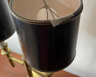 Lot 6014. $80.00. In the style of a Chapman Lamp, 2 light brass fixtures with black shades, 16" x 30.5" t x 7"dia shade, 6" square base. Unmarked. The shades are not in perfect shape, but the lamp makes a statement!