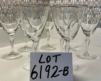 Lot 6192B. $36.00. Lot of 9 Fostoria Water Goblets or Wine Stems 7"tall with Fostoria marking on base. Silver rim. $36.00