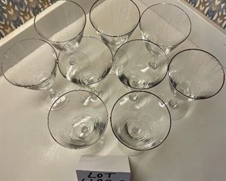 Lot 6192B. $36.00. Lot of 9 Fostoria Water Goblets or Wine Stems 7"tall with Fostoria marking on base. Silver rim. $36.00