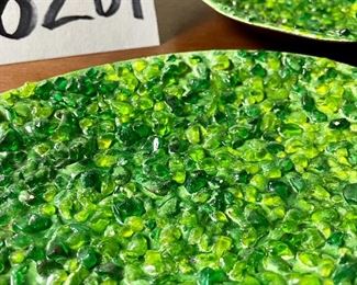 Lot 6201. $90.00. A trio of mid-century enamel on copper pieces from Gerte Hacker. They are all signed and have a pebble tray. Scalloped green: 5.5"dia, yellow dish: 5.25"dia, and oval: 7.5"x4.5"