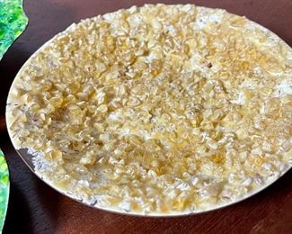 Lot 6201. $90.00. A trio of mid-century enamel on copper pieces from Gerte Hacker. They are all signed and have a pebble tray. Scalloped green: 5.5"dia, yellow dish: 5.25"dia, and oval: 7.5"x4.5"