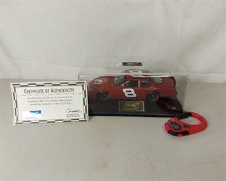Revel Collection 1:24 Diecast Scale Replica of the Budweiser 2003 Test Car Chevrolet Monte Carlo Driven by Dale Enhardt Jr with Carabiner and Certificate of Authenticity