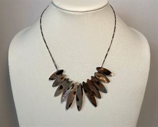 Reversible mother of pear like material necklace - 18 inches in length - price 30 dollars - chain is sterling silver