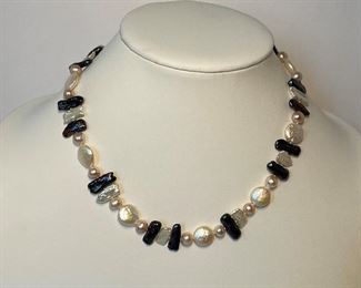 Pearl necklace with sterling silver clasp - necklace 18 inches in length - price 100 dolars 