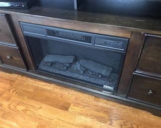 view of fireplace with tv center