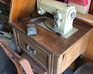 antique sewing machine and table  - lots of sewing  at this one 