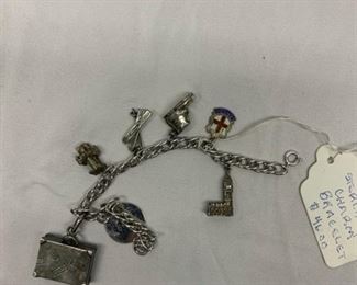 Various sterling silver charms. Big Ben, Suitcase, Shoe, Shield, Cross