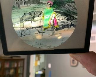 About 50 of these color slides. Don't know anything about it other than there is a Bausch and Lomb magic lantern that comes with them.