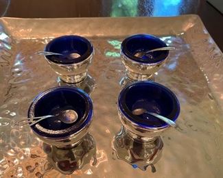 Set of 4 silver-plate salt cellars with cobalt blue liners. 