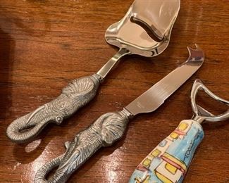 Assorted cheese knives and bottle opener.