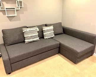 $300.00 Ikea sofa with storage & trundle. Excellent condition. 58W 35D 26H (sofa), 31W 58D 26H (trundle)