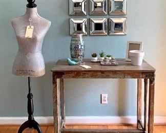 Fun home decor at a beautiful Kirkwood home. $220 Rustic wooden farm table, 37.25W 19D 31.5H. $80.00 Nine piece mirrored wall decor, 26W 2.5D 26H. $60.00 Dress form, 15W 58H.