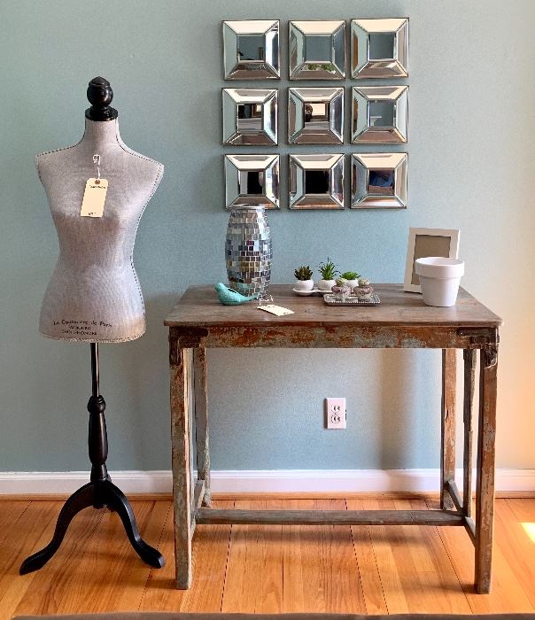 Fun home decor at a beautiful Kirkwood home.  $220 Rustic wooden farm table, 37.25W 19D 31.5H. $80.00 Nine piece mirrored wall decor, 26W 2.5D 26H. $60.00 Dress form, 15W 58H.