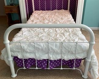 $100 White twin iron bed. Box spring included.