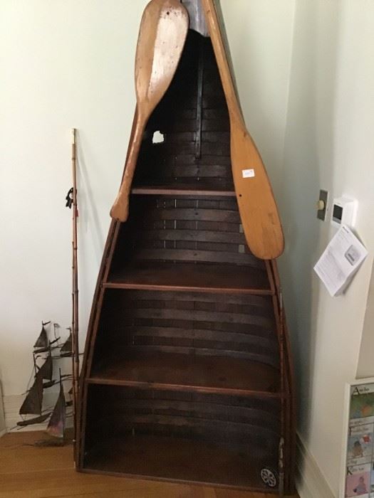 Half Canoe shelf unit. So popular. Paddles included.