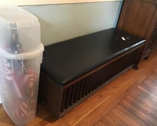 Cedar chest with padded seat lid.