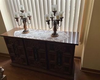 . . . this is a nice credenza with matching candelabras