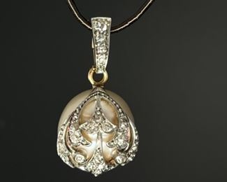 Very large pearl pendant mounted in gold and diamond setting. Circa 1905.