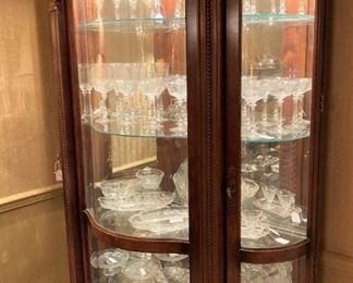 Curved front china cabinet filled with Heisey "Orchid" Crystal