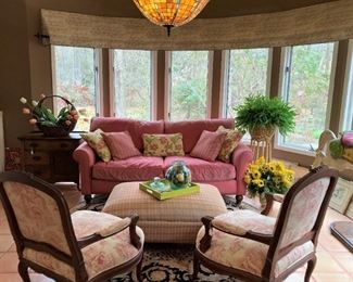 Inviting grouping of sofa, chairs, and ottoman