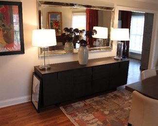 Gorgeous oversized neutral mirror framed with mirror, pair of table lamps and ALF Group Italian Design Credenza or Buffet with a modern silk and wool blend rug.