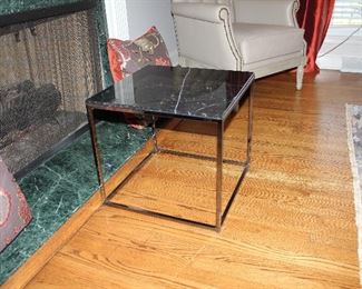 Steel and marble side table, there are a pair of these, one corner chipped on one table.