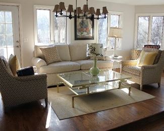 Great seating group with brass and glass cocktail table, including a pair of club chairs and a lovely sofa.