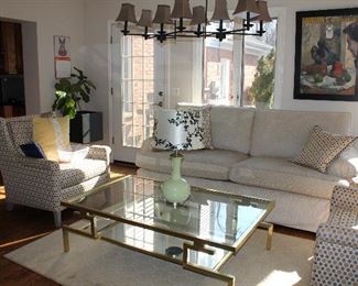 Lamps, throw pillows, artwork, pedestals, and plants.