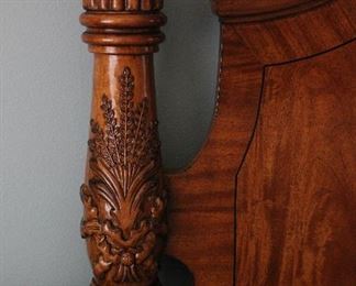 Impeccable carved detail and gorgeous wood graining on the headboard.
